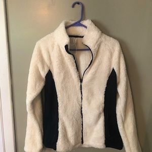 Medium Exertek fluffy crème and black zip up with zip up pockets. Super comfy!